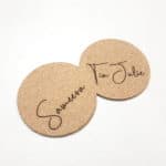 Round Cork Coasters with Laser-Engraved Names, Displayed on a Plain White Background.