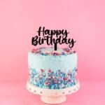 Stylish black acrylic happy birthday cake topper on a beautifully decorated cake. Available in Rose Gold and glitter.