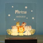 front view of a lit Acrylic LED custom night light showcasing a safari design and personalised name and date.