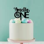 First Birthday Cake Topper in black acrylic - On a white cake