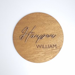 Round Plywood Nursery Name Sign Featuring 3D RAW MDF First Name and Laser-Engraved Last Name, Displayed on a Plain White Background.