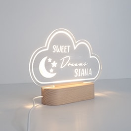 Cloud-Shaped Personalised Night Light with Child's Name Laser-Engraved on Clear Acrylic, Illuminated by LED from Wooden Base, Set Against a White Background.